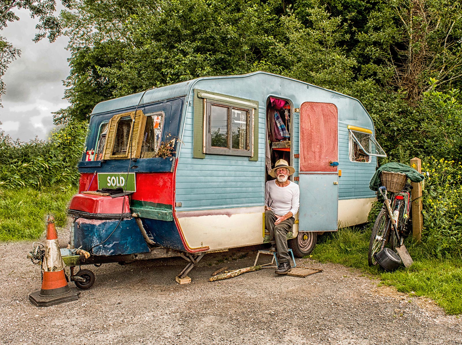 man sitting in trailer home